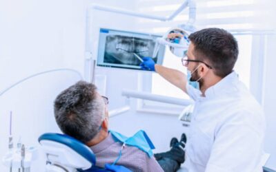 Dentist in Edmonton placing dental implant safely
